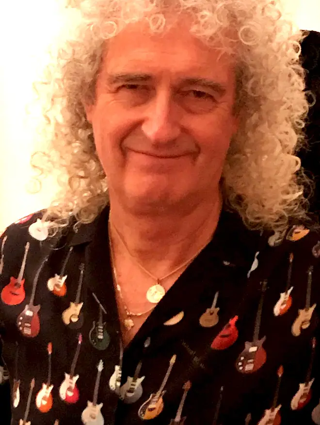 Brian May promoting his new shirt design – the same featured on bras and waistcoats