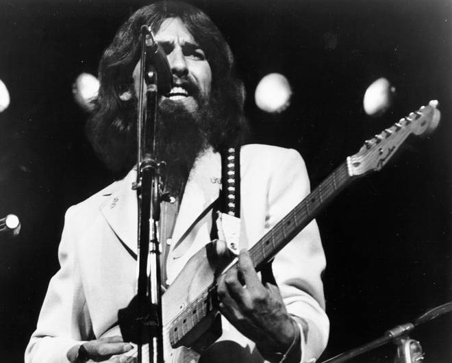George Harrison performing on stage in 1971