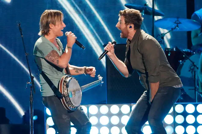 Keith Urban performing with Brett Eldredge