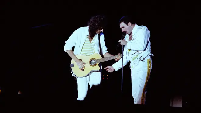 Brian May and Freddie Mercury performing live on stage at Knebworth Park