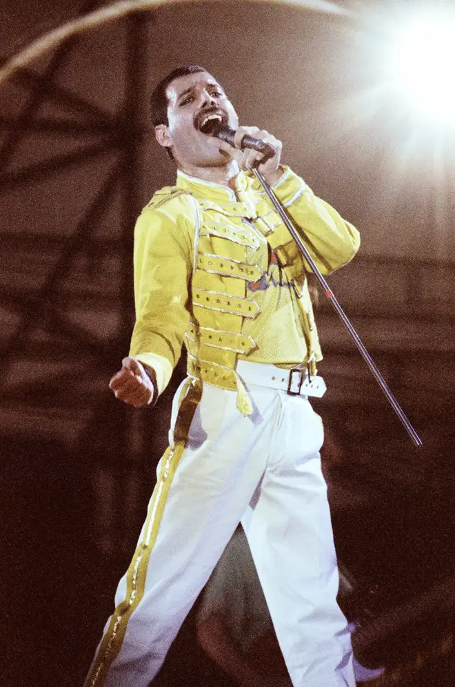 Freddie Mercury performing on stage in front of the 120,000 strong crowd at Knebworth Park August 9, 1986