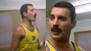 Freddie Mercury is seen wearing his iconic yellow tank top while pacing his dressing room in the minutes leading-up to the start of the huge concert.