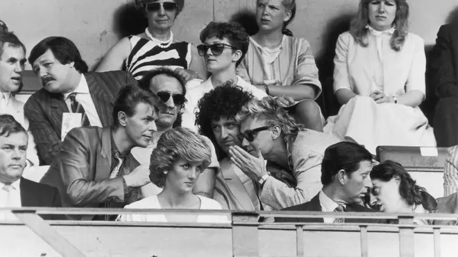 Bob Geldof has a word with Prince Charles, while David Bowie chats with Roger Taylor and Brian May of Queen, during the Live Aid Concert at Wembley Stadium, 13th July 1985.