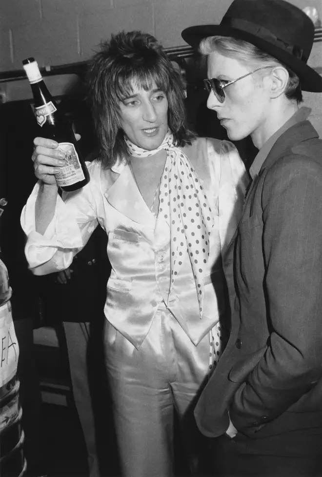 Rod Stewart talks with David Bowie backstage on February 24, 1975 at Madison Square Garden, where Stewart performed.