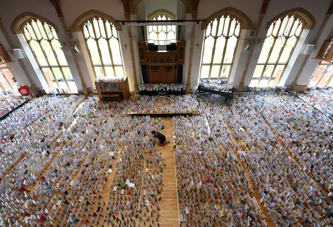 Colonel Tom has been sent over 120,000 birthday cards - enough to fill an entire school hall (pictured) - to celebrate his 100th birthday