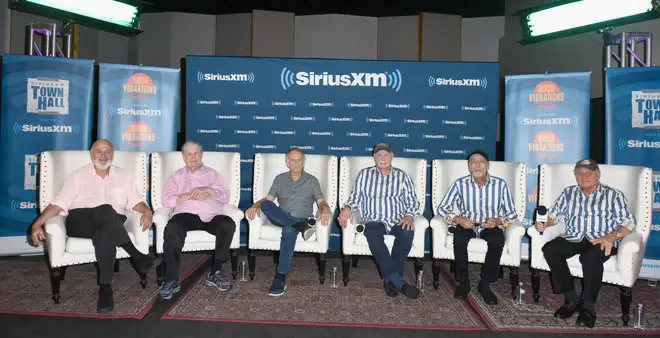 Host Rob Reiner, Brian Wilson, Al Jardine, Mike Love, David Marks and Bruce Johnston of The Beach Boys speak onstage together in July 2018 in Hollywood, California