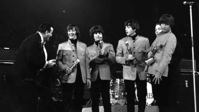 Tony Bennett presenting an award to The Beatles at the New Musical Express Poll Winners' Concert at Wembley, London, in 1965