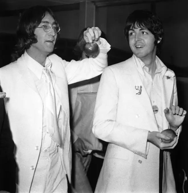 John Lennon and Paul McCartney at London Airport after a trip to America to promote their new company Apple Corps, 16th May 1968.