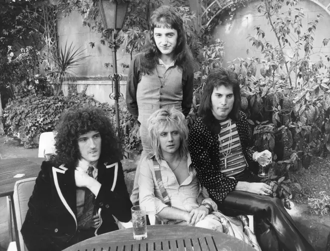Queen, from left to right; Brian May, John Deacon (standing), Roger Taylor and Freddie Mercury