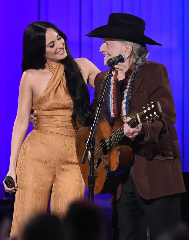 Kacey Musgraves performing with Willie Nelson at the 52nd Annual Country Music Association Awards in 2019