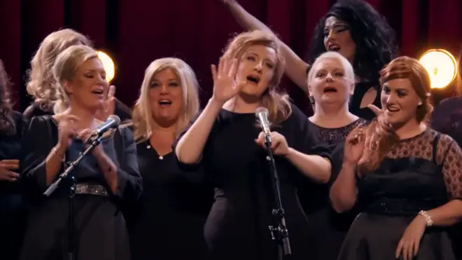 Once the secret is out, Adele is joined on stage by her impersonators to sing as a group