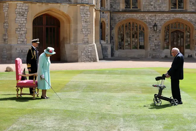 Captain Tom makes his way across the courtyard of Windsor Castle to meet the Queen