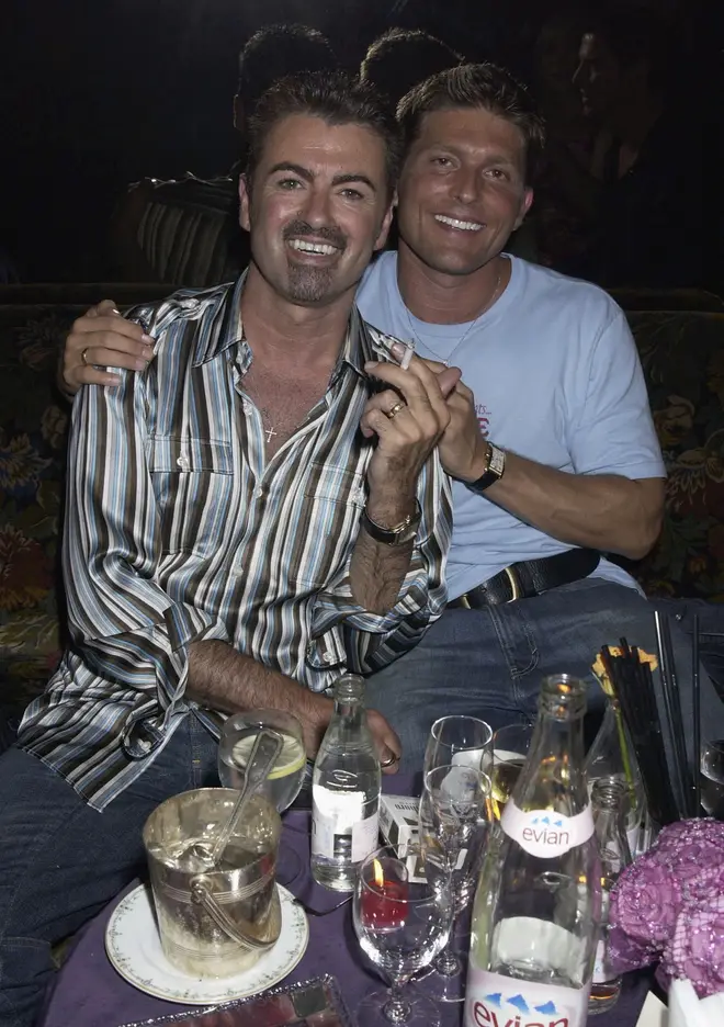 George Michael and partner Kenny Goss attend a party at The Ritz Hotel on 9th July 2002, in Paris