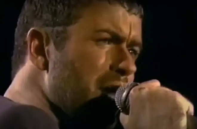 George Michael continues to look at the right-hand side of the stage where Anselmo is reportedly standing