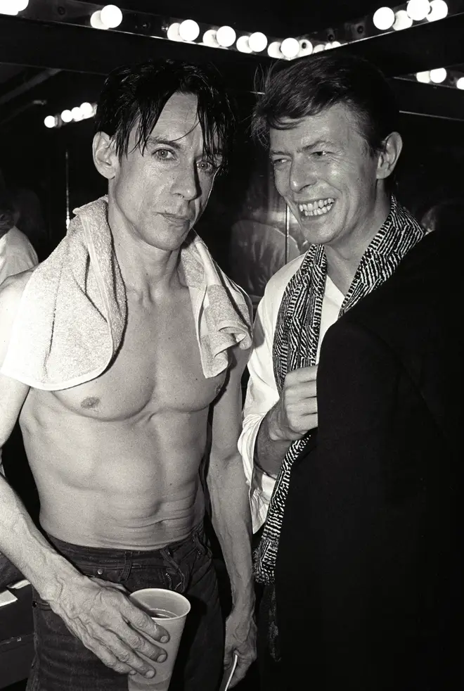 Great friends Iggy Pop and David Bowie pose backstage after Pop's concert at the Ritz, New York, New York, 1986.