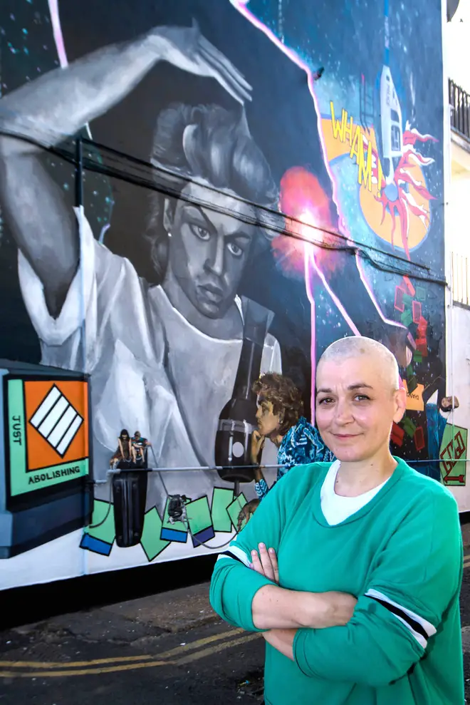 Artist Dawn Mellor in front of her George Michael mural