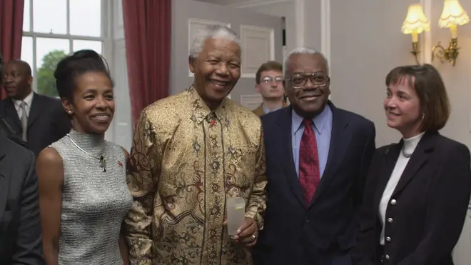 Sir Trevor McDonald has split from his wife Josephine after 34 years of marriage. Pictured with wife Jo, far right, and Nelson Mandela, centre left, in 2001.