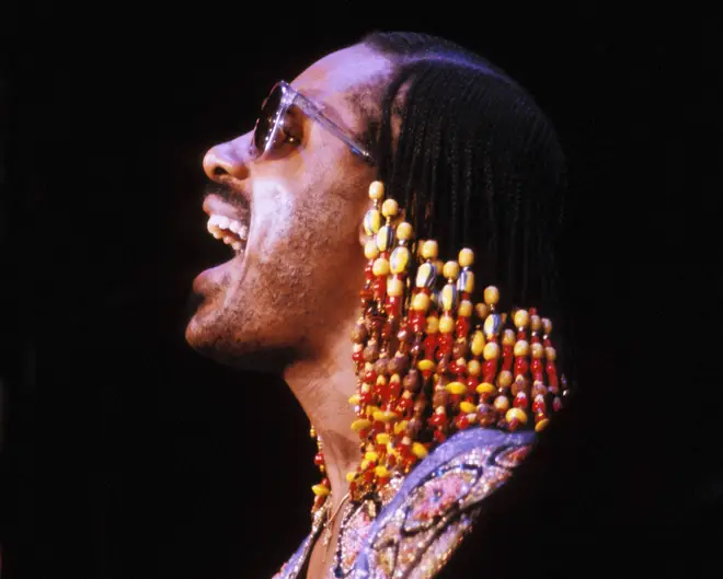 Stevie Wonder singing on stage in 1980