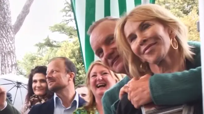 Sting and wife Trudie Styler, whose vineyard grounds the festival was taking place in, are seen standing in the audience and encouraging the singer as she starts to perform the iconic song.