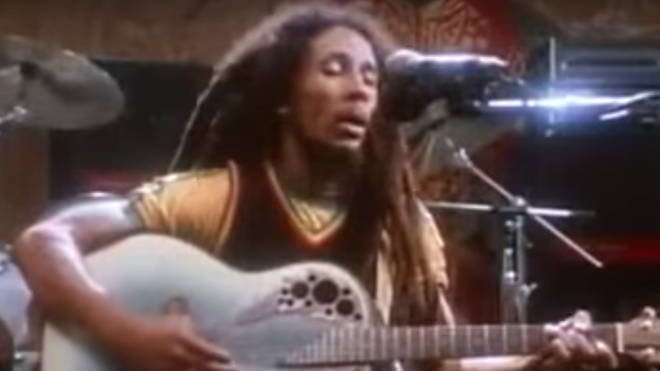 Filmed playing a blue acoustic guitar, the rare footage shows Bob Marley, 35, singing 'Redemption Song', the last track from his final album, Uprising, released a year before his death.
