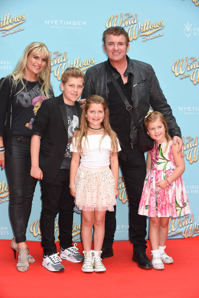 Shane with wife Christie and their three kids in 2017