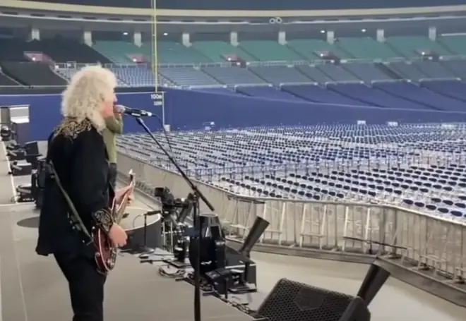 Brian May playing his guitar to thousands of empty seats, accompanied by Roger Taylor on the drums and Adam Lambert on vocals, is not something you see everyday.