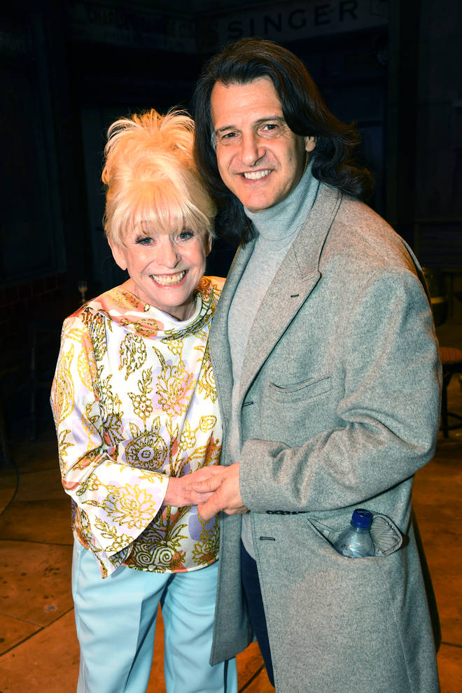 The beloved actress was best known for her roles in the Carry On films and as the iconic Peggy Mitchell in Eastenders. Pictured with husband Scott in 2019.