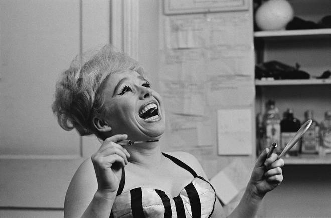 The national treasure who was best known for playing Peggy Mitchell in Eastenders and her famous roles in the Carry On films. Pictured in New York City in 1964.