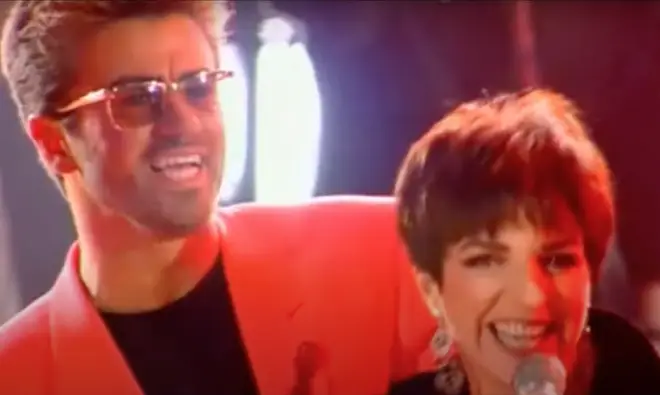 The Cabaret star took to the stage joined by Queen's Brian May on guitar, John Deacon on bass and Roger Taylor on drums and sang part of the sing with George Michael (pictured)
