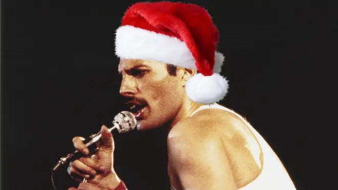 The special recording from 1977 captures the atmospheric audio of Queen's Freddie and Brian May performing an acoustic version of the festive classic to the audience in Inglewood, California. (Pictured, Freddie Mercury performing in 1982)