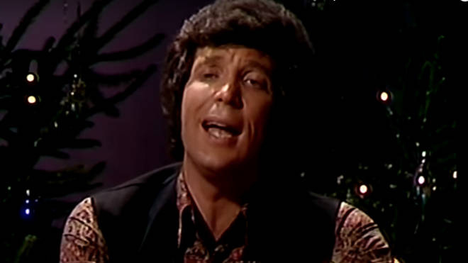 The lights then go down and the camera pans to a close up of Tom Jones as he starts to sing 'I'll Be Home For Christmas' in his famously deep baritone voice.