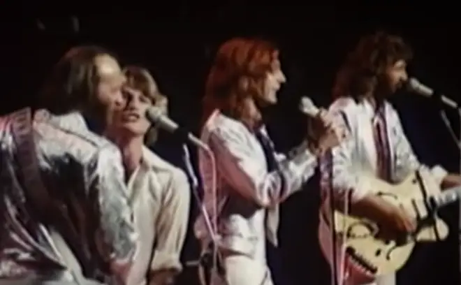 The 1979 performance came nine years before the Bee Gees would officially announce Andy Gibb would be joining them as the fourth member of the band in 1988.