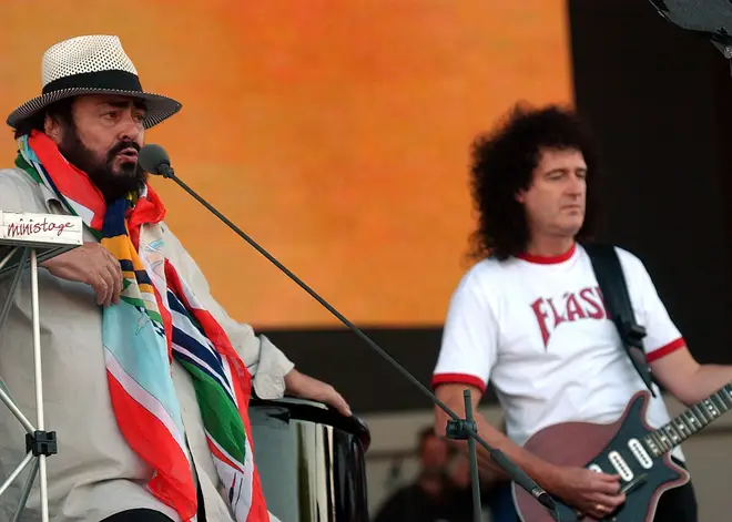 Pavarotti sings during a sound check session with Queen Guitarist Brian May to prepare for the Pavarotti and Friends 2003 concert May 25, 2003 in Modena, Italy.