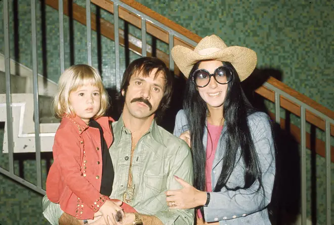 Cher released her album Believe in 1998 and dedicated it to her ex-husband, with an inscription in its booklet reading "In memory of Son". (Pictured: Sonny, Cher and Chastity Bono in 1973)