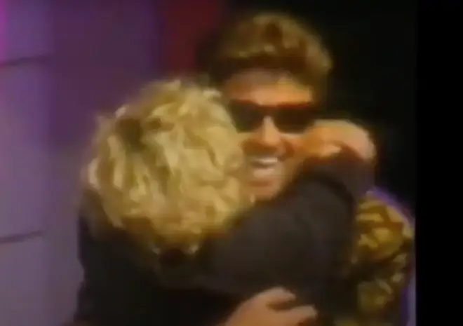 The singer himself then walks out on stage and after waving to the crowd immediately gives Madonna a huge bear hug, before approaching the podium.