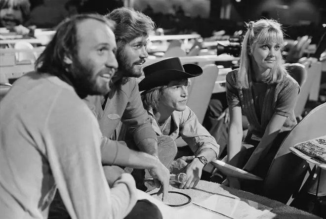 Maurice, Barry and Andy Gibb pictured in rehearsals with Olivia Newton-John at the 1979 UNICEF event.