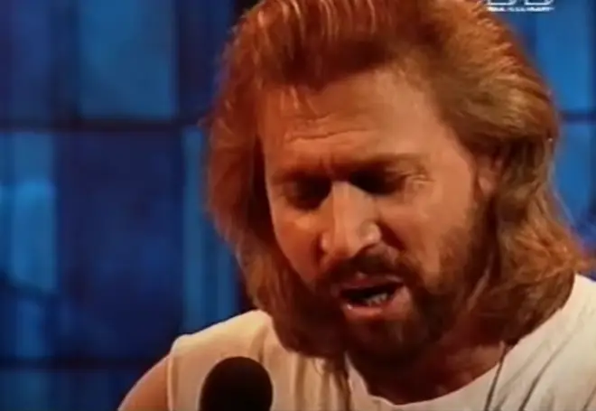 Dressed stonewash denim – the must have uniform of the early '90s – the Bee Gees gave a spine-tingling performance of the hit song. Pictured: Barry Gibb.