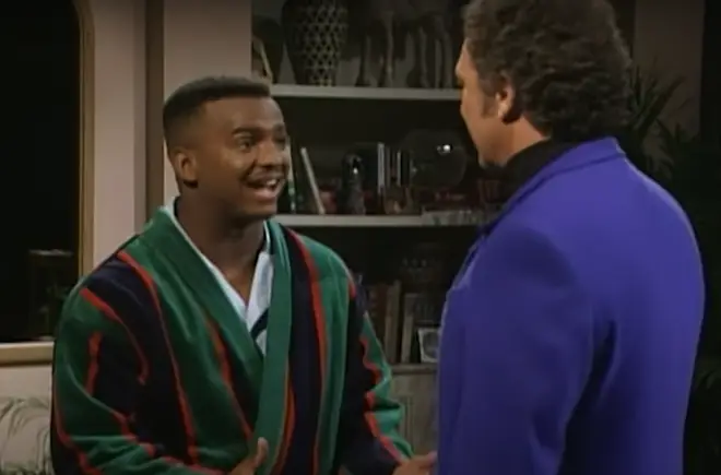 As a depressed Carlton, played by Alfonso Ribeiro, contemplates his fate, his guardian angel Tom Jones arrives to cheer him up and reassure him.