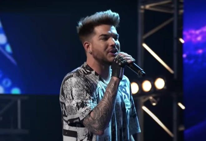 Adam leaps on stage tand shows off his amazing vocal ability by singing 'I Want To Break Free' to the stunned audience