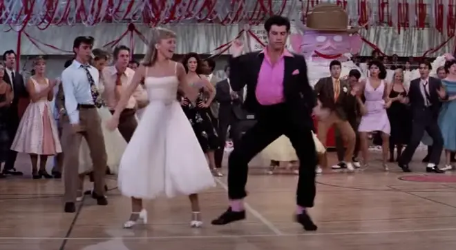 The 66-year-old actor stepped back into the dancing shoes of his T-Birds character Danny Zuko to reenact that famous 'Born to Hand Jive' routine from the 1978 hit film.