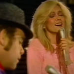 Elton John appeared on TV special Olivia Newton-John: Hollywood Nights when she invited him to come on stage and play a special version of his 1973 hit, 'Candle In The Wind.'