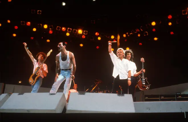 Queen at Live Aid on July 13, 1985. The band's 17-minute set has become one of the famous moments in music history.