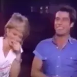 Vidoe has resurfaced of Olivia Newton-John and John Travolta laughing hysterically during a Grease interview in 1983 (pictured)
