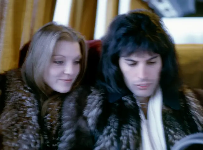 Freddie Mercury and Mary Austin on a train in late 1970's
