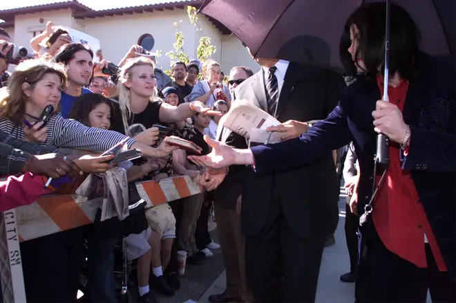 Prince said he didn't realise how famous his father was growing up. Pictured, Michael Jackson signs autographs for fans in 2002.