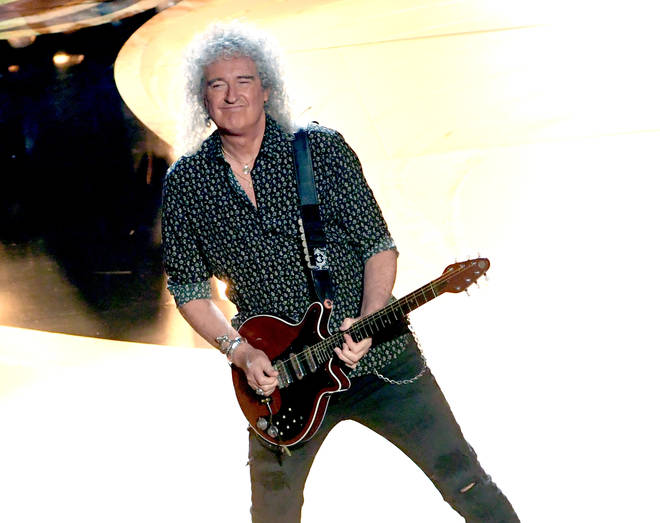 “We’ve all come through some dark times,” says Brian May. “Now we want to give hope for brighter days to come.” Pictured on stage at the Oscars in 2019.