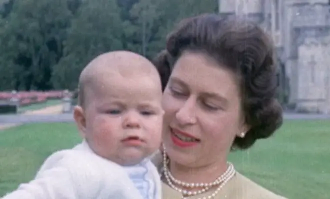 Unseen photos and footage of the Queen, including this photo of Elizabeth II holding Prince Andrew at Balmoral in 1960, will be aired in the ITV documentary.