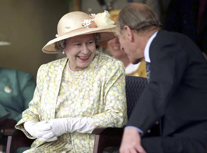 The Queen and Prince Philip chat during a visit to Vukuzakhe High School in Durban, South Africa on March 23, 1995.