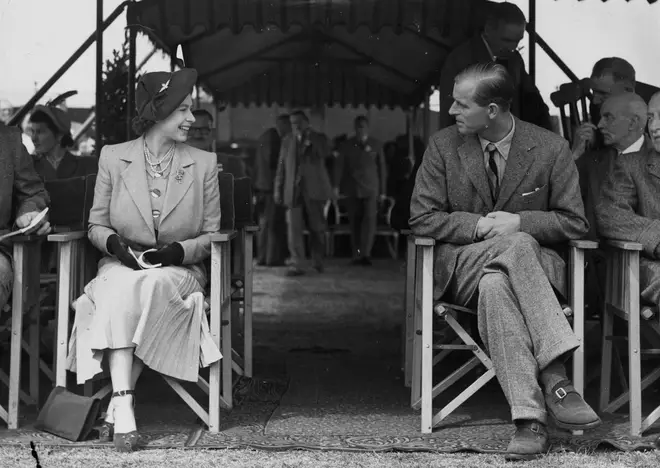 Newlyweds Princess Elizabeth and the Duke of Edinburgh share a laugh at the Royal Horse Show at Windsor, 12th May 1949.