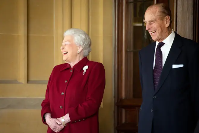 Queen Elizabeth II and Prince Philip share a laugh at Windsor Castle in April 2014.
